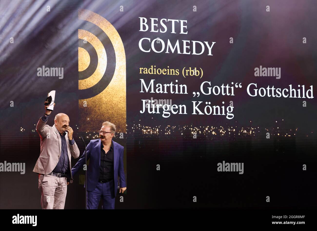 Hamburg, Germany. 02nd Sep, 2021. Rolf Kunz, editor, and Robert Dieter  Heinrich Skuppin, head of programming at RBB's Radio Eins station, stand on  stage during the German Radio Awards ceremony to accept