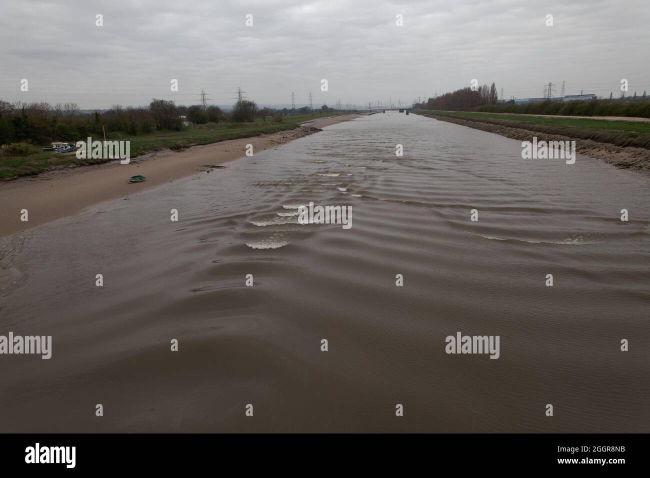 Following waves (whelps) breaking on the Dee Tidal Bore in New Cut channel between Queensferry and Saltney Ferry Stock Photo
