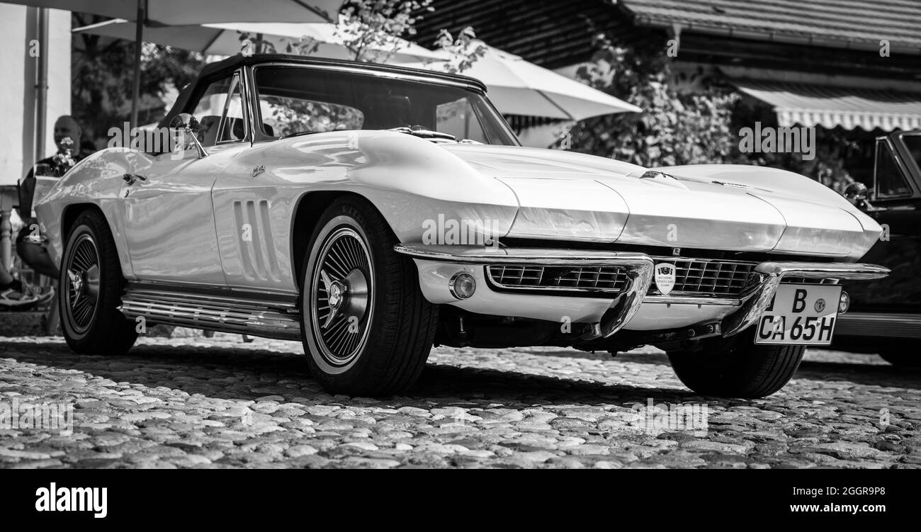 DIEDERSDORF, GERMANY - AUGUST 21, 2021: The sports car Chevrolet Corvette Sting Ray Convertible (C2), 1965. Black and white. The exhibition of 'US Car Stock Photo