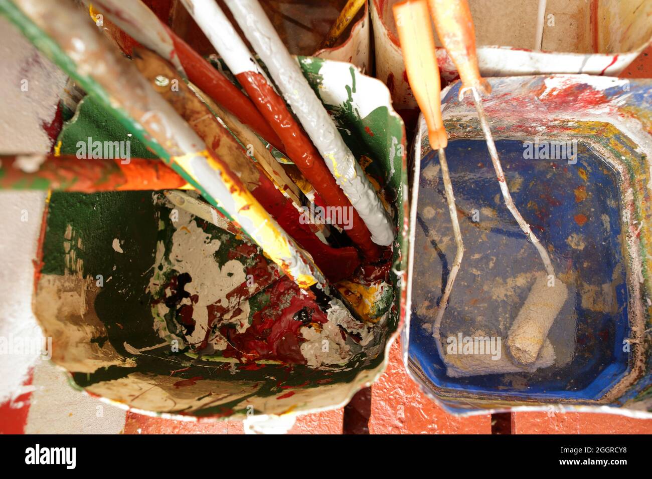 colourful rollers and paint bucket in the boatswain store Stock Photo