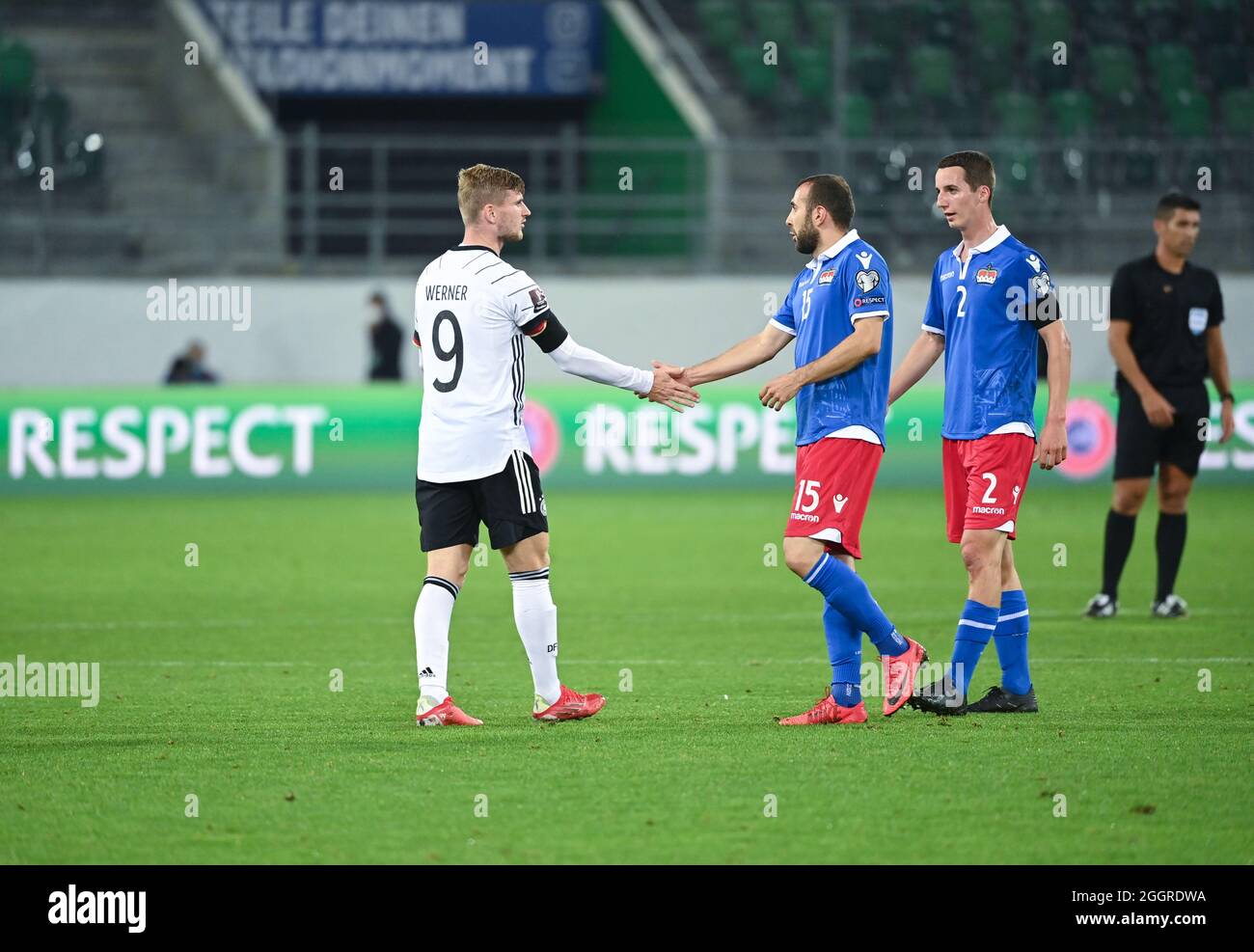 St. Gallen, Switzerland. 02nd Sep, 2021. Football: World Cup Qualification Europe, Liechtenstein - Germany, Group Stage, Group J, Matchday 4 at Kybunpark. Germany's Timo Werner (l) and Liechtenstein's Seyhan Yildiz shake hands after the match. Credit: Sven Hoppe/dpa/Alamy Live News Stock Photo