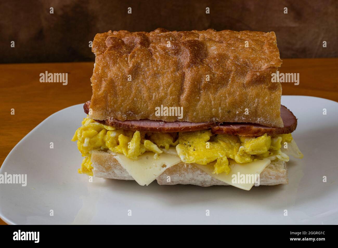 scrambled egg with canadian bacon and swiss cheese on ciabatta Stock