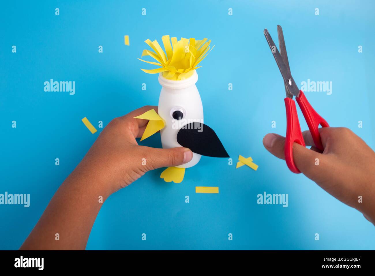 penguin craft for kids, how to make toy from yogurt bottle Stock Photo