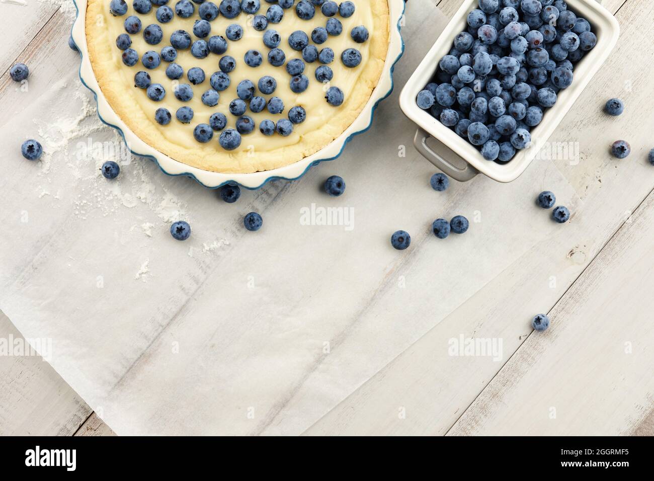 Cooking blueberry pie or tart with fresh berries Stock Photo