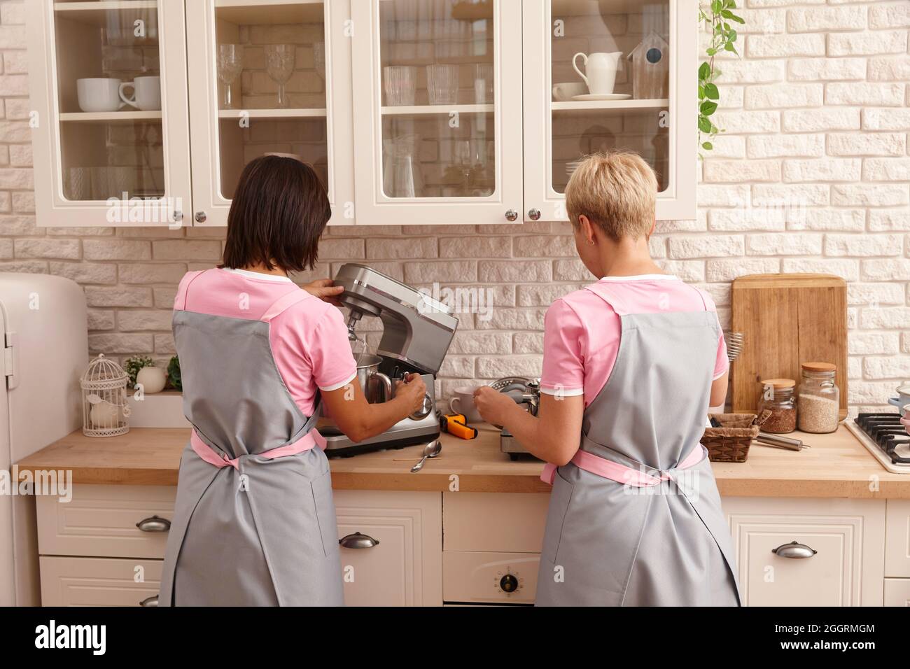 Professional pastry chef team working in the kitchen Stock Photo