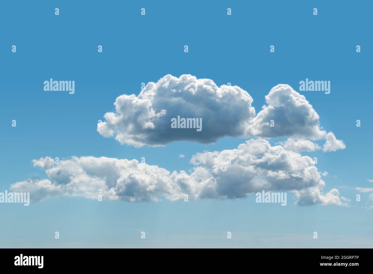 Blue sky with fluffy cumulus clouds texture background  Stock Photo