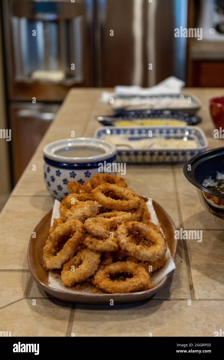 Fried Calamari Squid Rings Freshly Cooked on Platter in Kitchen Stock Photo