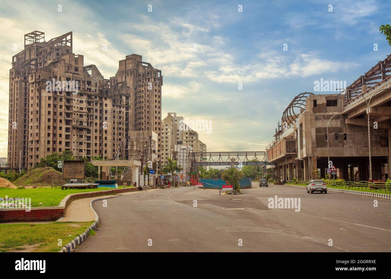 City road with residential building apartments at sunrise at New Town