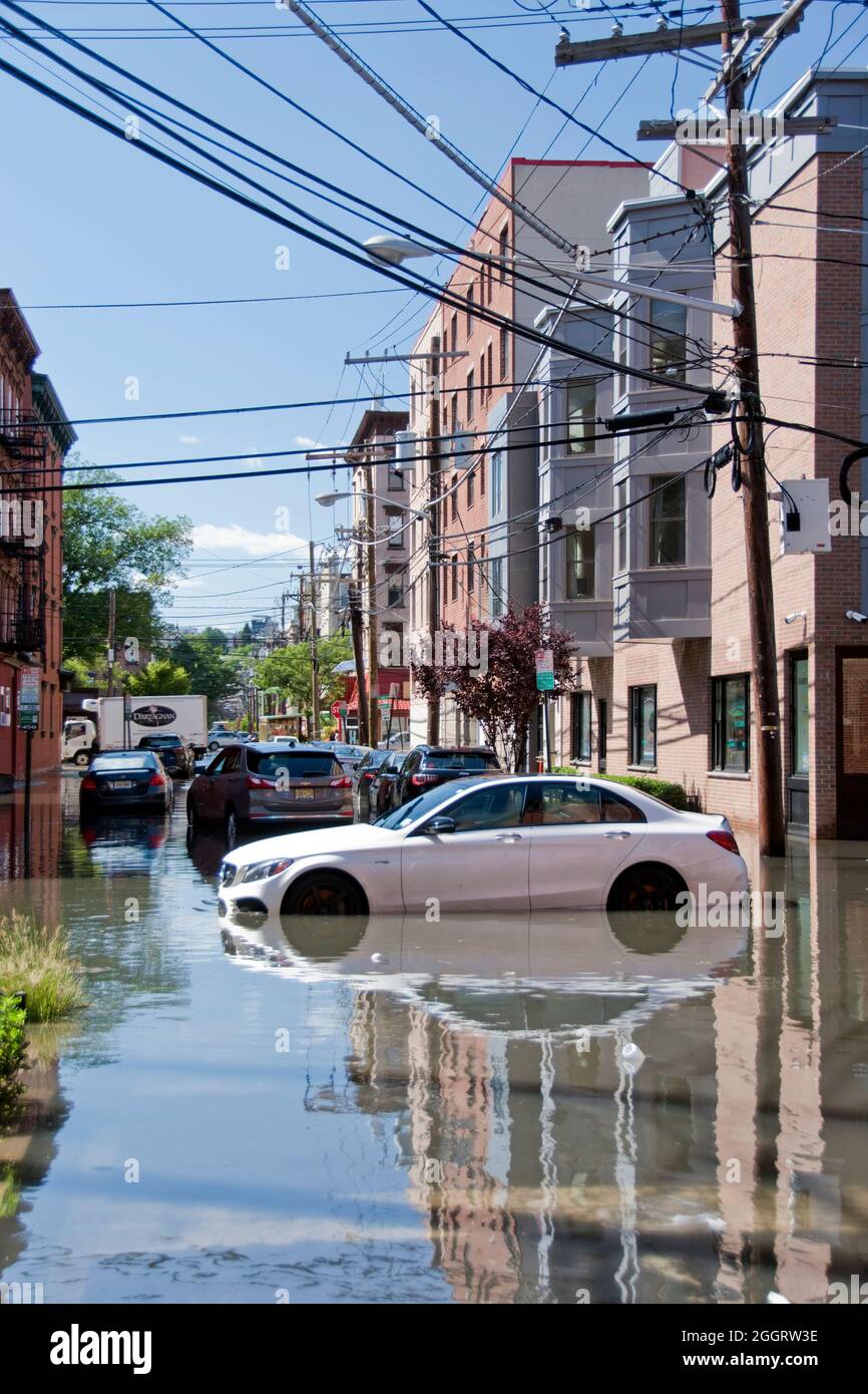 A Mercedes luxury car on a flooded street caused by Hurricane Ida rain in Hoboken, New Jersey, USA. Stock Photo