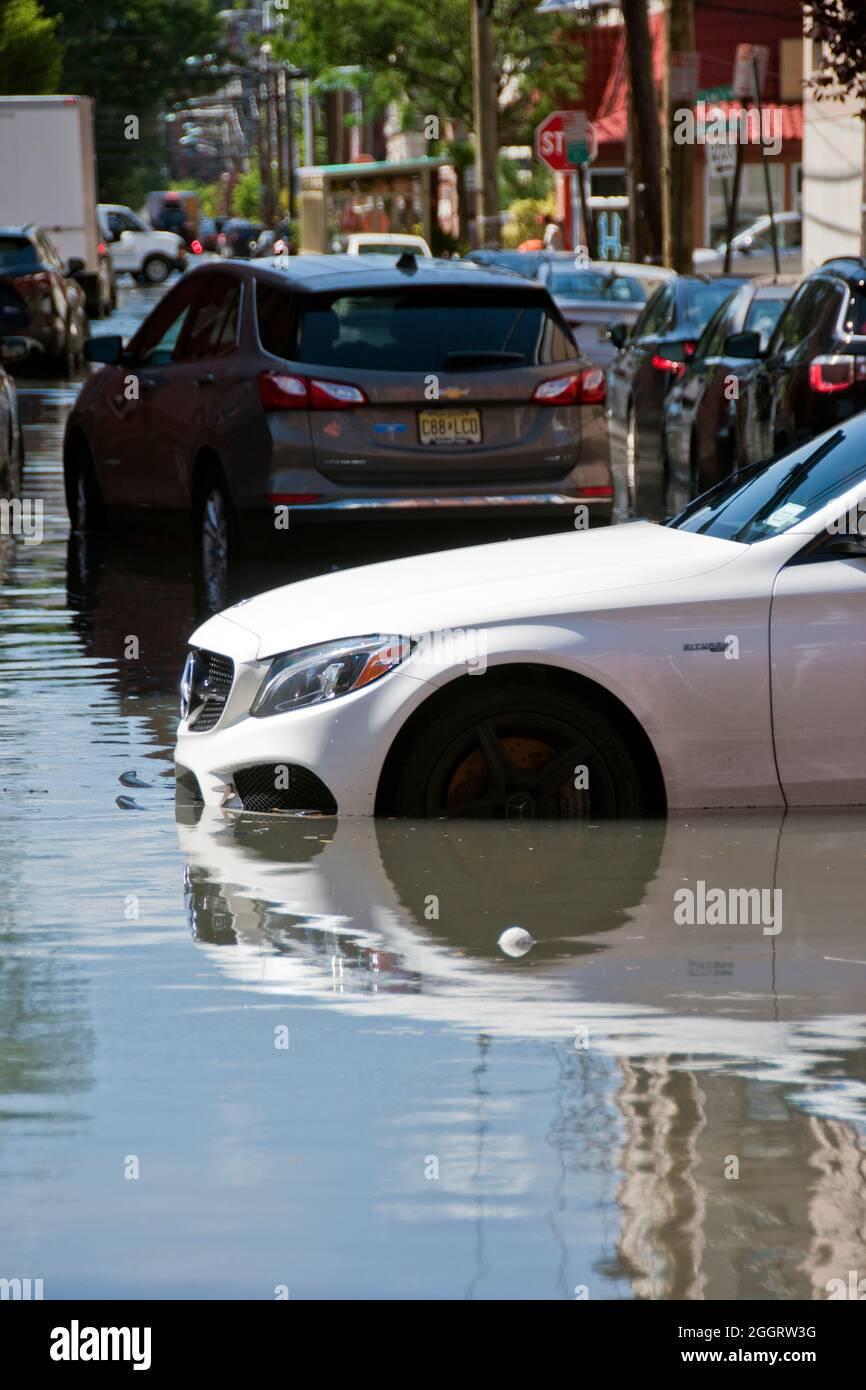A Mercedes luxury car on a flooded street caused by Hurricane Ida rain in Hoboken, New Jersey, USA. Stock Photo