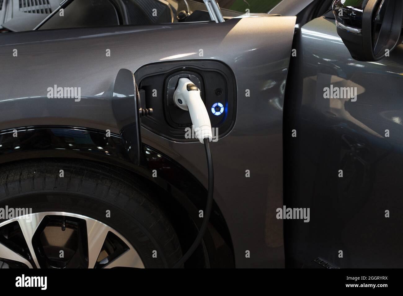 An electric car being charged Stock Photo Alamy