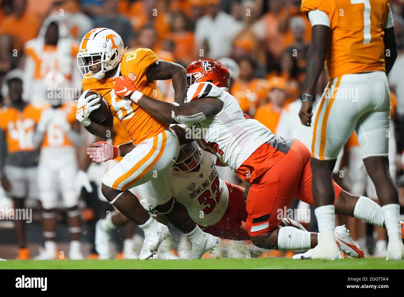 September 02, 2021: Tiyon Evans #8 of the Tennessee Volunteers runs the  ball while Karl Brooks #44 of the Bowling Green Falcons tries to tackle him  during the NCAA football game between