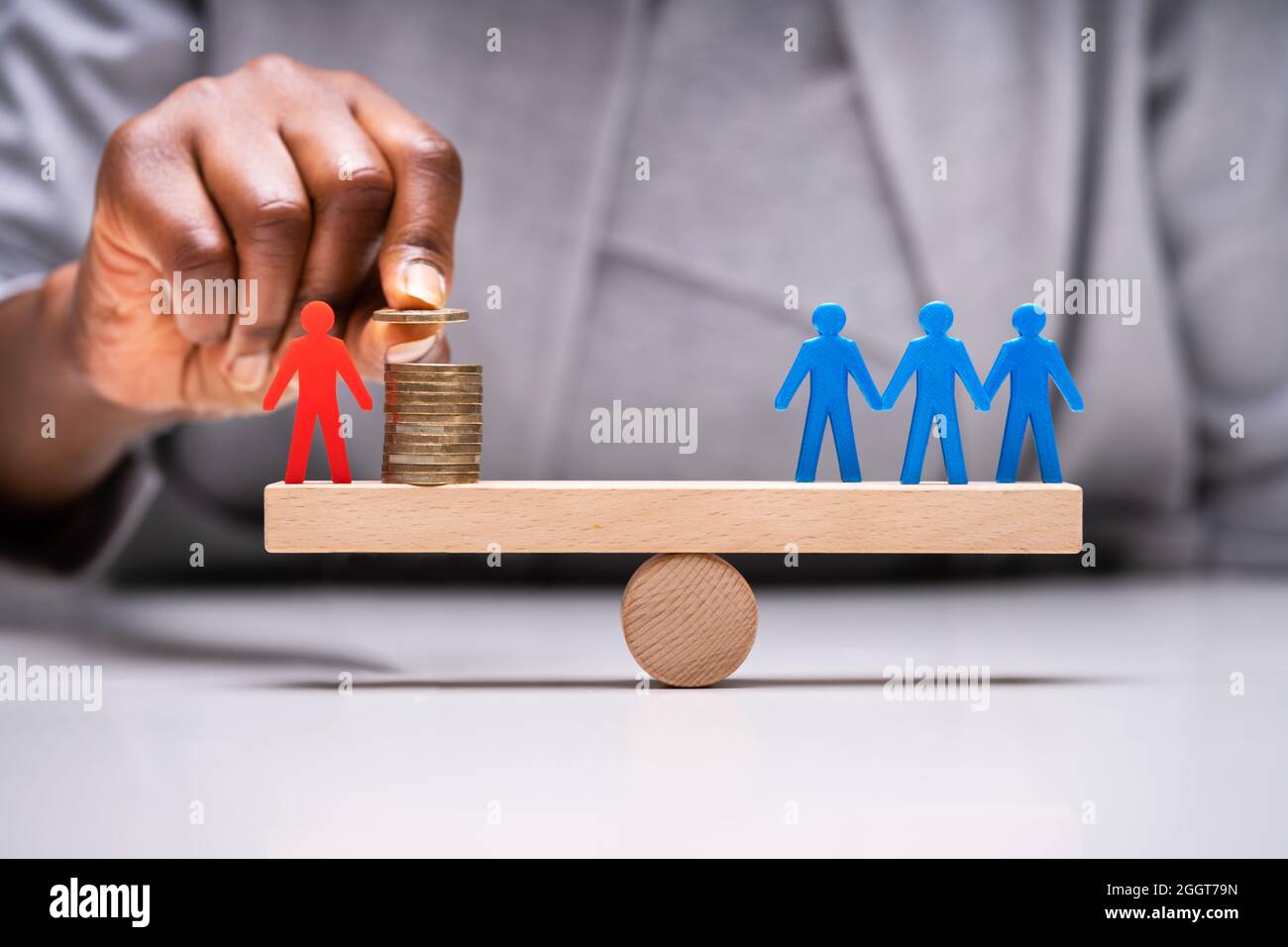 Business Candidate Imbalance Comparison And Money Leverage Stock Photo