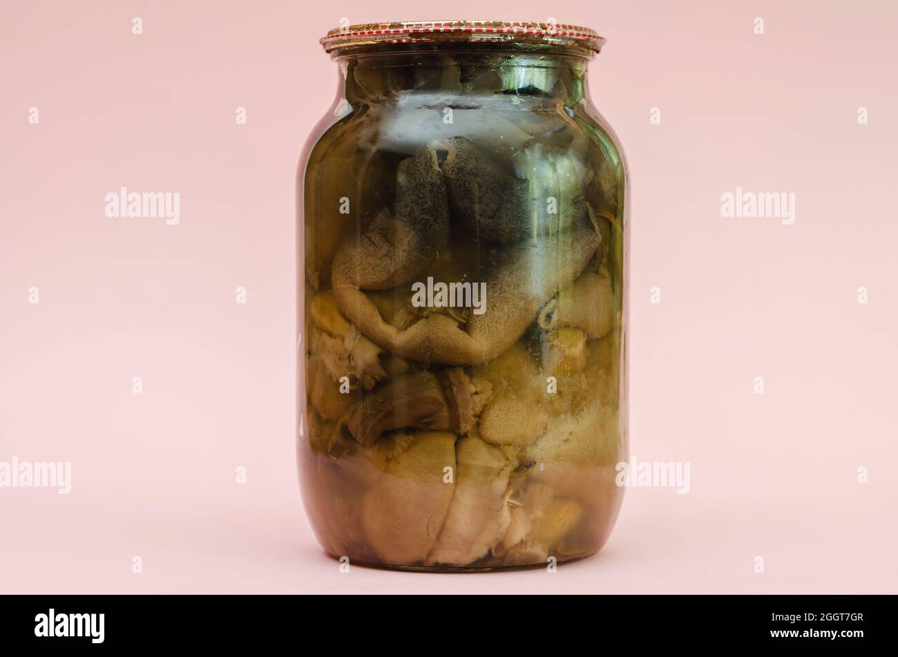 Botulism, food poisoning from canned foods concept. Glass jar wi Stock Photo