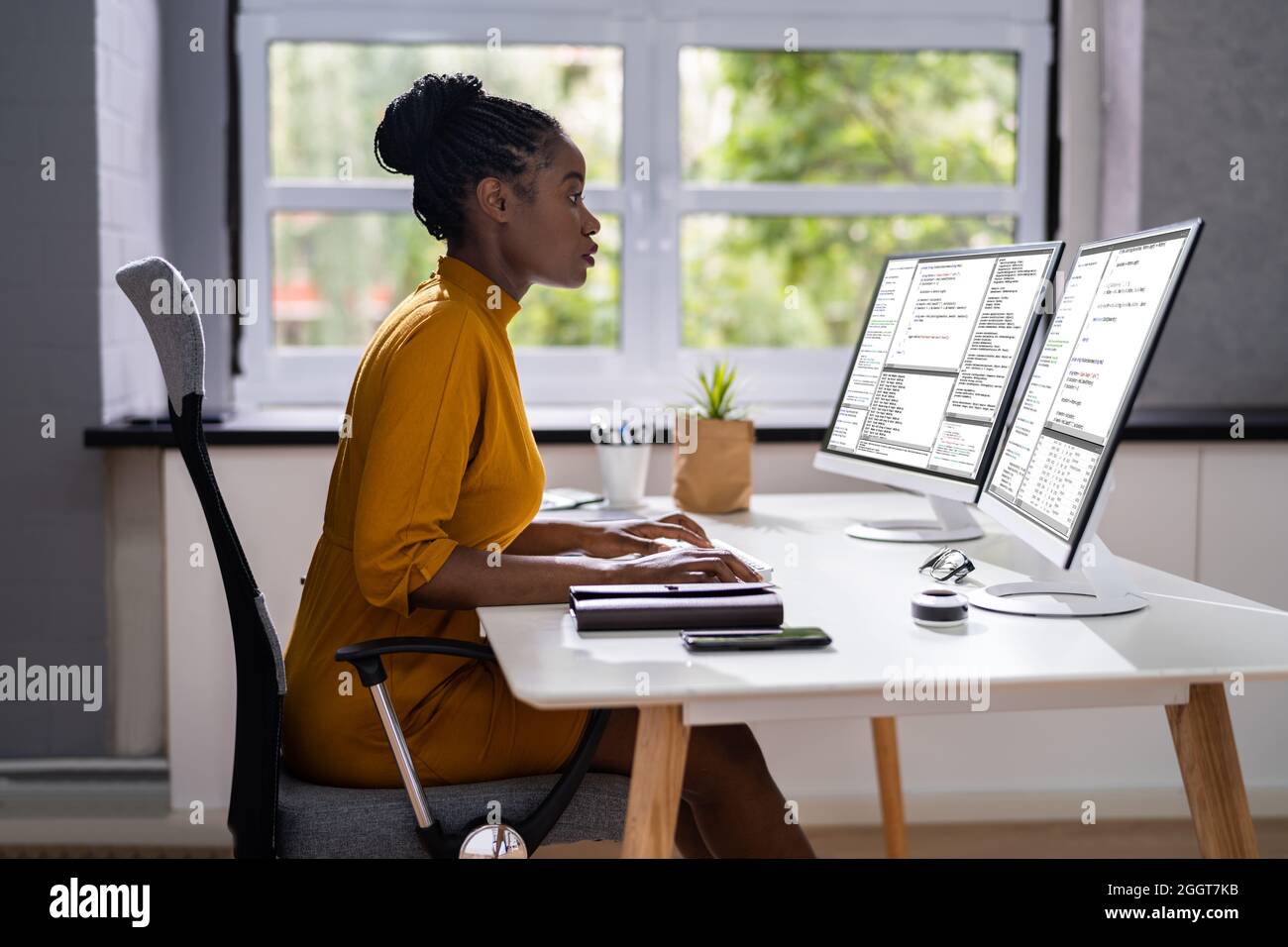 African American Woman Programmer. Girl Coding On Computer Stock Photo ...