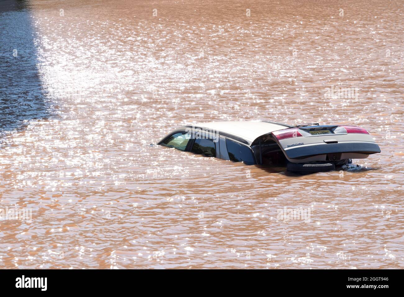 Open tailgate vehicle submerged underwater in the aftermath of Tropical Storm Ida. Stock Photo
