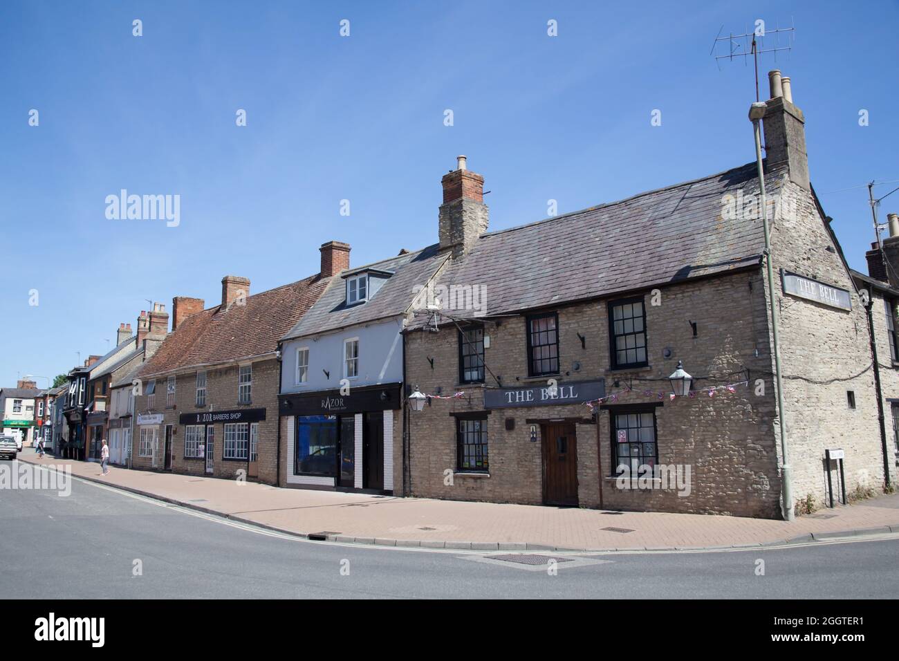 Pubs and shops on Bell Lane in Bicester, Oxfordshire in the UK Stock Photo