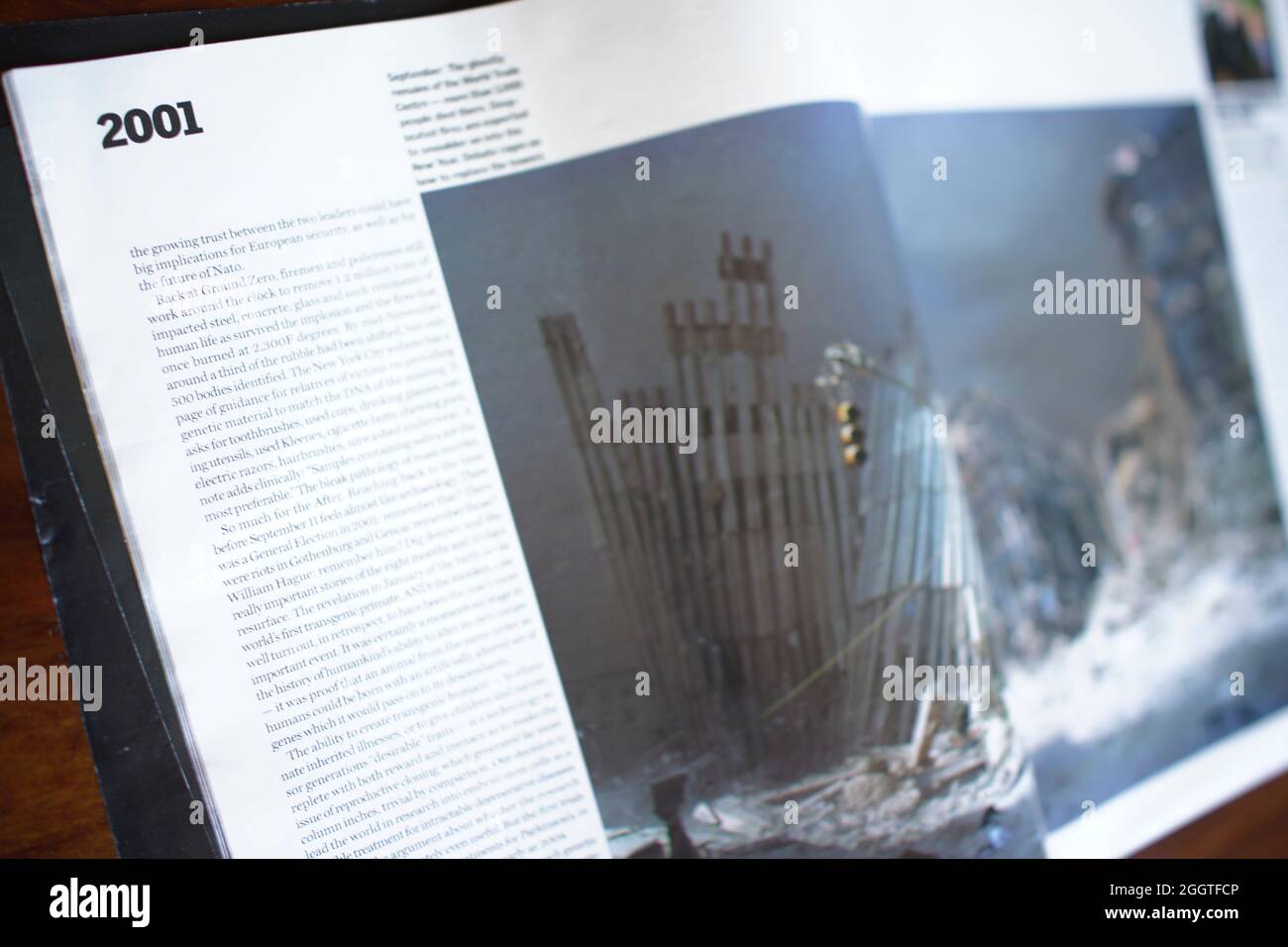 2001 - magazine article with photograph showing the skeletal remains of The World Trade Centre after the terrorist attacks of September 11, 2001. Manhattan, New York. Guardian newspaper weekend supplement : The Year in Pictures with essay by Alan Rusbridger Stock Photo