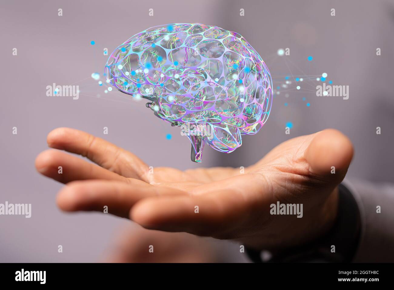 Hand holding an illustration of a human brain - the concept of ...