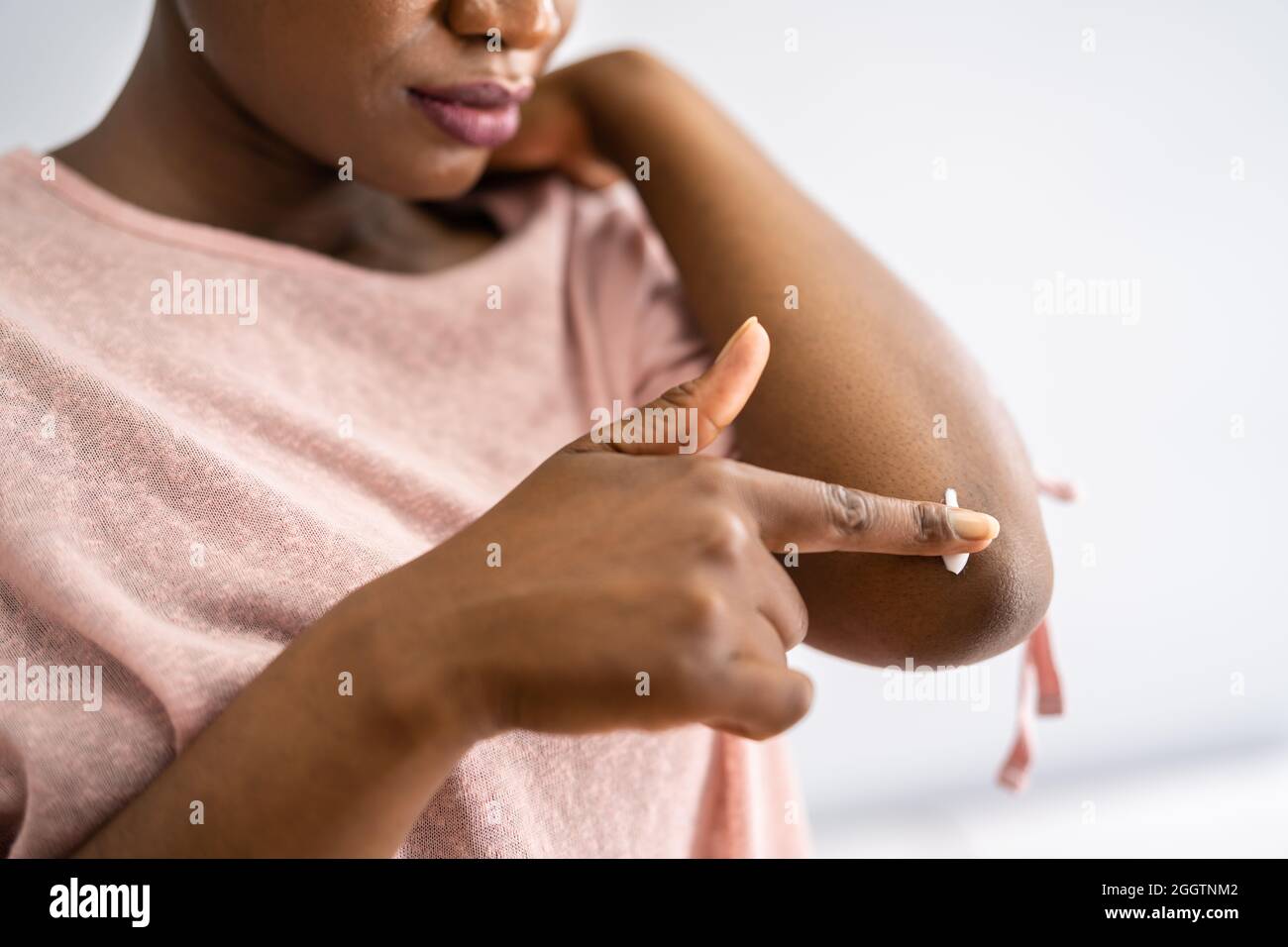 American African Woman Hand Care Cream To Skin Stock Photo
