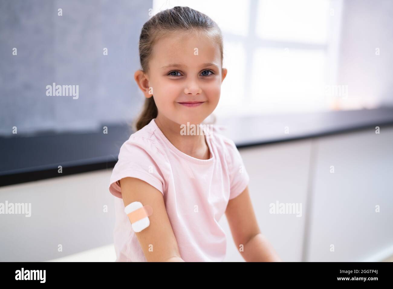 Kid Corona Virus Vaccine Injection. Covid-19 Child Immunization Stock Photo