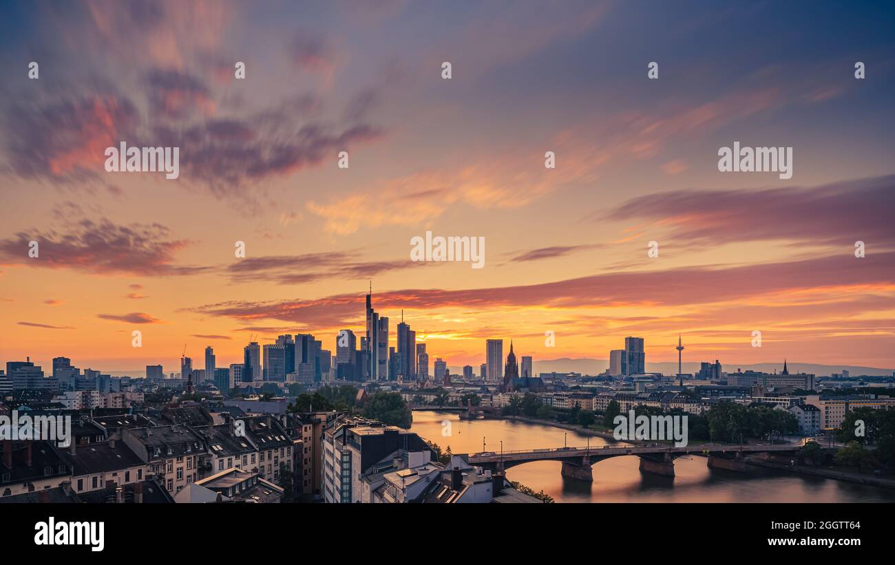 Sunset above Frankfurts Mainhattan, the central business district of Frankfurt in Germany. The word is a portmanteau of Main, the river on which Frank Stock Photo