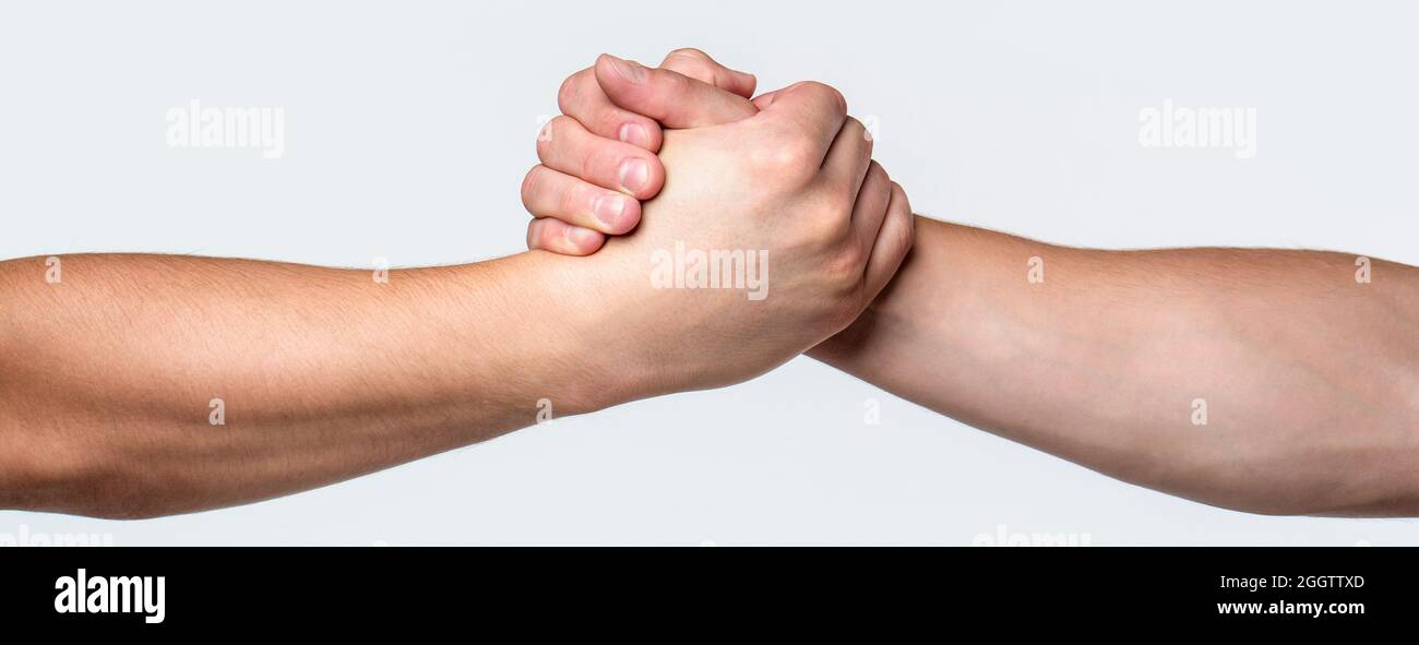 Two hands, helping arm of a friend, teamwork. Helping hand outstretched, isolated arm, salvation