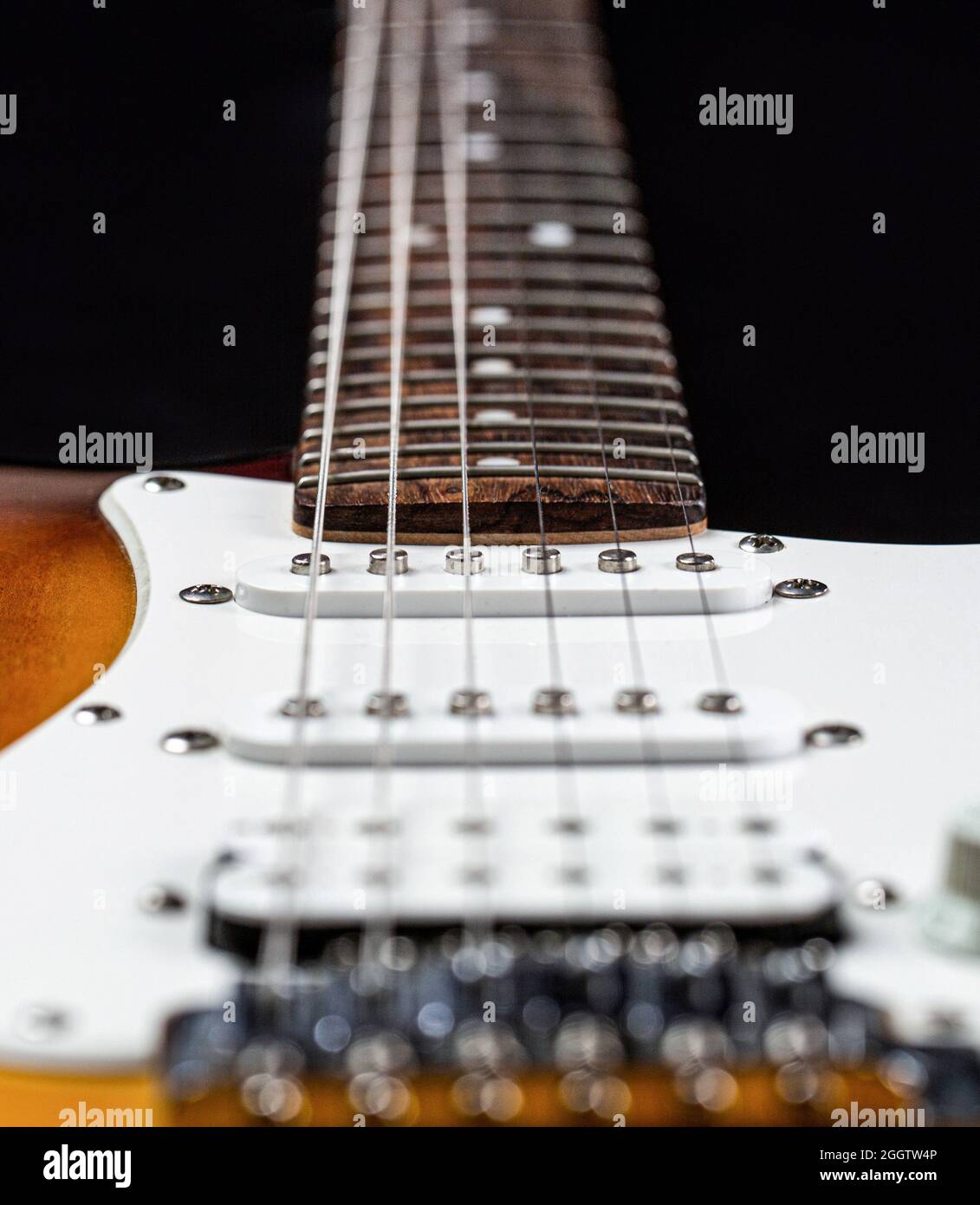 Musical instrument for rock, blues, metal songs. Guitar strings, close up. Electric Bass Guitars. Electric guitar. Close up of music guitar. Stringed Stock Photo