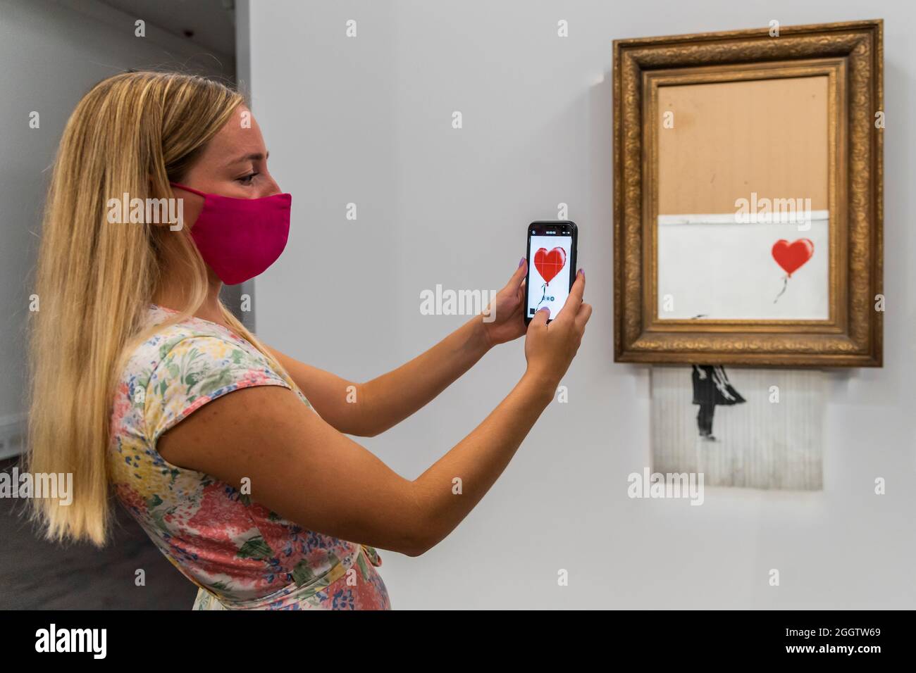 EMBARGOED till 12 noon 03 September 2021 - London, UK. 3rd Sep, 2021. Banksy's Love is in the bin, a painting shredded by the artist in Sotheby's london auction room in 2018. It is to be offered in the contemporary art evening auction on october 14 with an estimate of £4-6 million. It sold in 2018 for £1m. On show at Sotheby's New Bond Street Galleries, London. The sale takes place on 14 Oct. Credit: Guy Bell/Alamy Live News Stock Photo