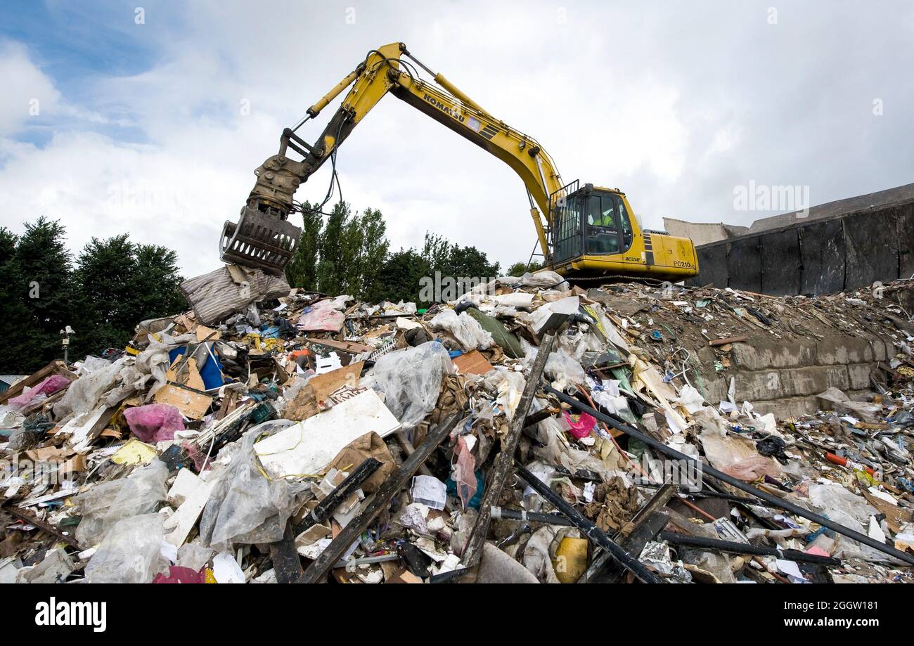 Komatsu crawler excavator working at a materials recycling facility in the UK. Stock Photo