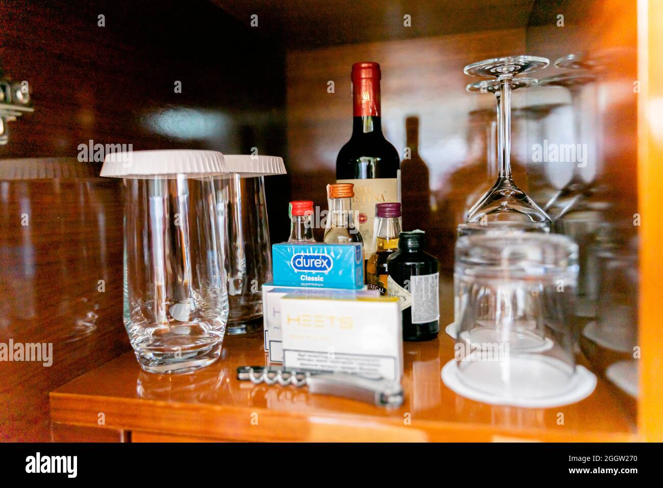 Mini bar contents including condoms and e-cigarettes, wine Stock Photo