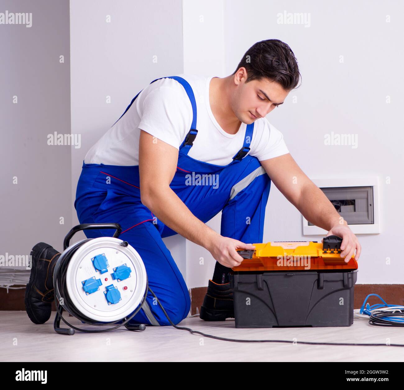 The man doing electrical repairs at home Stock Photo