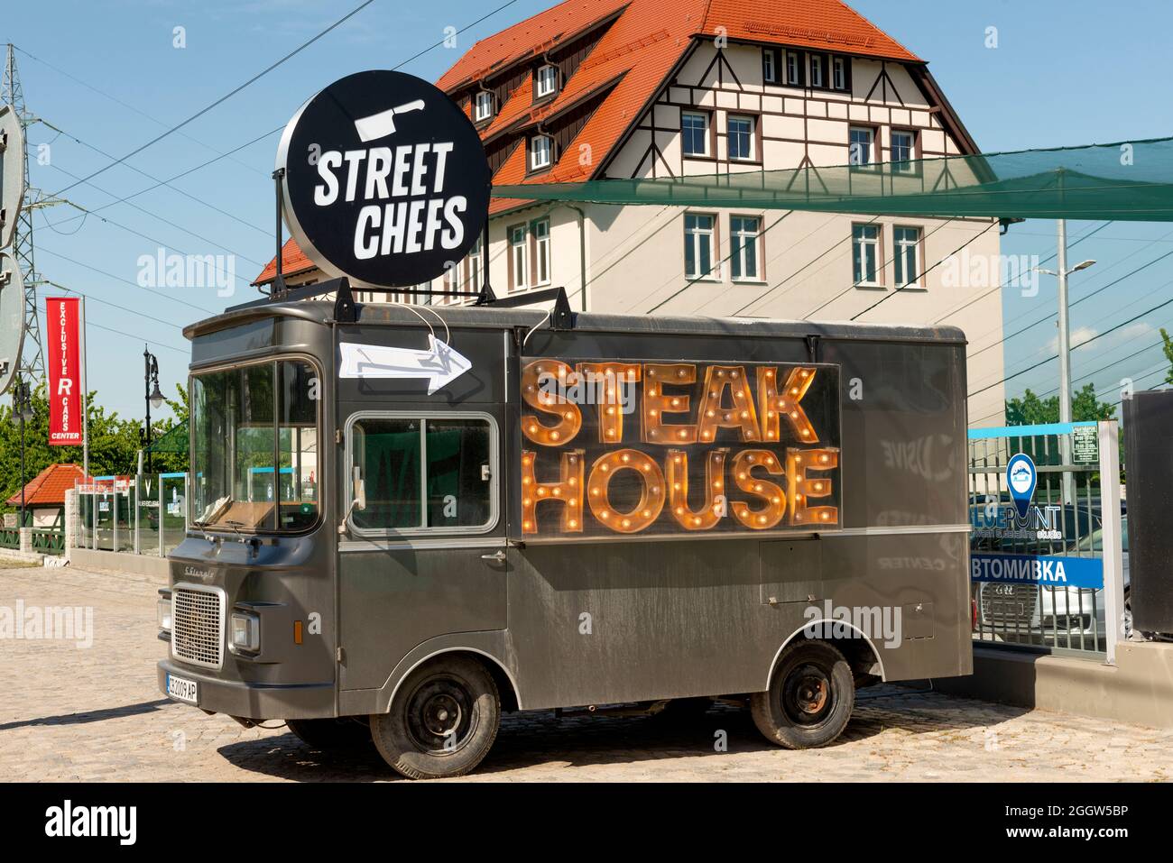 Fast food business Street Chefs Steak House pointed arrow advertisement on vintage Fiat 241 T San Giorgio truck by a road near Sofia, Bulgaria Stock Photo