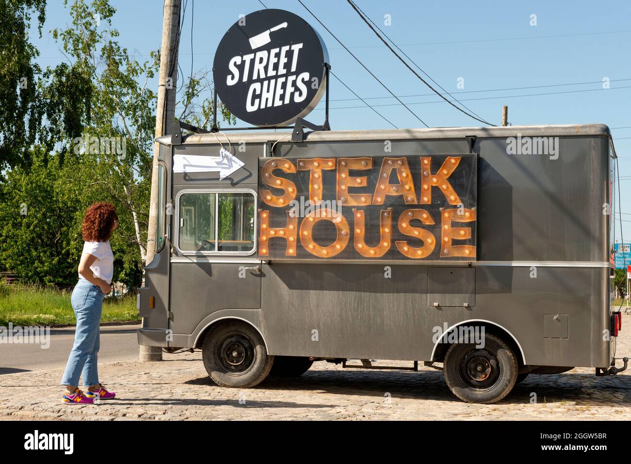 Fast food business Street Chefs Steak House pointed arrow advertisement on vintage Fiat 241 T San Giorgio truck by a road near Sofia, Bulgaria Stock Photo