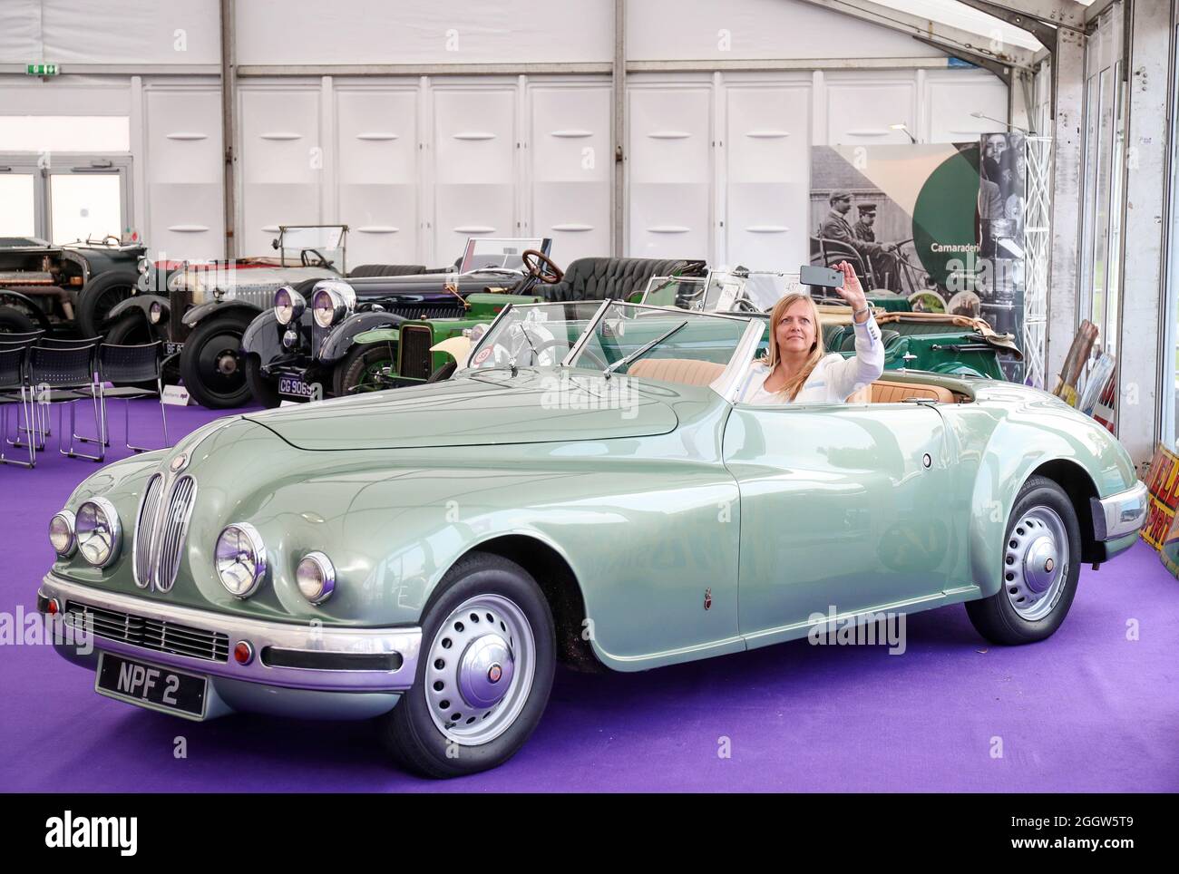 Beaulieu, Hampshire, UK 3rd September 2021. Lynnie Farrant poses with a rare 1949 Bristol 402 Drophead Coupé formally owned by Hollywood actress Jean Simmons, which is to be offered at auction at the Bonhams MPH Beaulieu Sale this Sunday, with an estimate of £150,000 – 200,000. One of the most glamorous luxury motor cars of its day, the Bristol was bought new for the Hollywood actress by her future husband and fellow star Stewart Granger as one of a matching pair. Credit: Stuart Martin/Alamy Live News Stock Photo