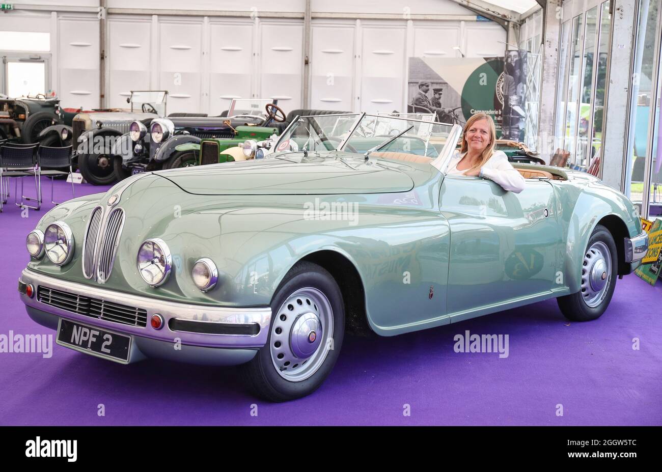 Beaulieu, Hampshire, UK 3rd September 2021. Lynnie Farrant poses with a rare 1949 Bristol 402 Drophead Coupé formally owned by Hollywood actress Jean Simmons, which is to be offered at auction at the Bonhams MPH Beaulieu Sale this Sunday, with an estimate of £150,000 – 200,000. One of the most glamorous luxury motor cars of its day, the Bristol was bought new for the Hollywood actress by her future husband and fellow star Stewart Granger as one of a matching pair. Credit: Stuart Martin/Alamy Live News Stock Photo