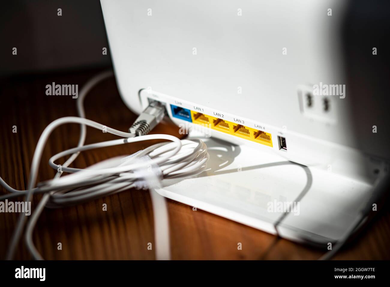 Berlin, Germany. 02nd Sep, 2021. ILLUSTRATION - A LAN cable is plugged into  the DSL slot of a WLAN router. Credit: Fabian Sommer/dpa/Alamy Live News  Stock Photo - Alamy
