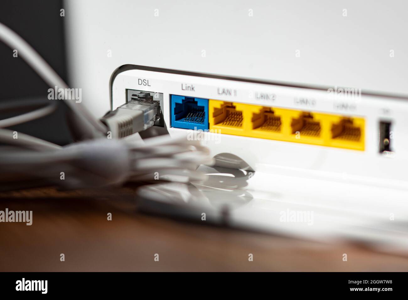 Berlin, Germany. 02nd Sep, 2021. ILLUSTRATION - A LAN cable is plugged into  the DSL slot of a WLAN router. Credit: Fabian Sommer/dpa/Alamy Live News  Stock Photo - Alamy