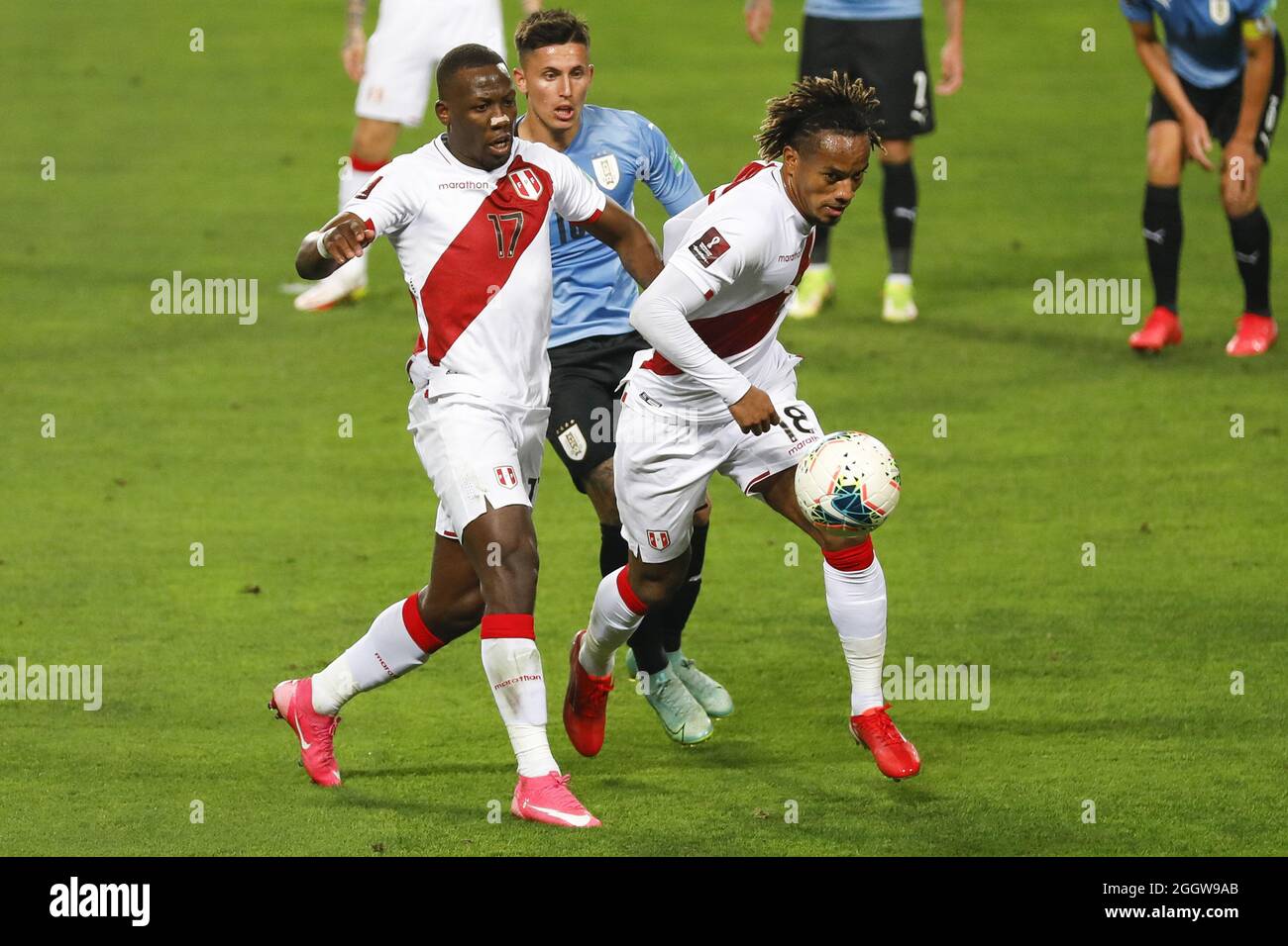 Lima, Peru. 02nd Sep, 2021. Luis Advicula e Andre Carrillo during the 2022 Football World Cup Qualifier between Peru adn Uruguay at the Estádio Nacional del Peru in Lima, Peru. The game ended 1-1 with Tapia scoring for the hosts in the 24th minute and de Arrascaeta equalizing for Uruguay in the 29th. Credit: SPP Sport Press Photo. /Alamy Live News Stock Photo