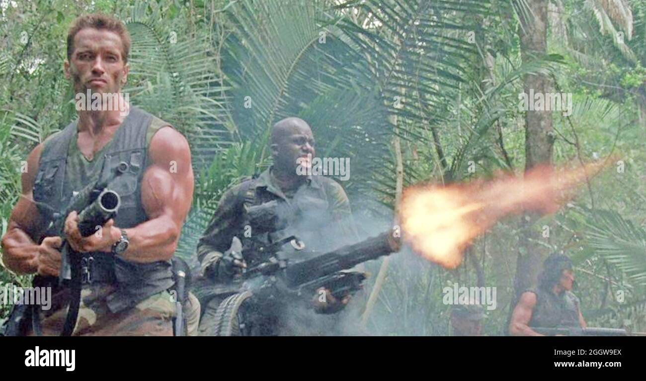 PREDATOR 1987 20th Century Fox film with Arnold Schwarzenegger at left and Carl Withers Stock Photo