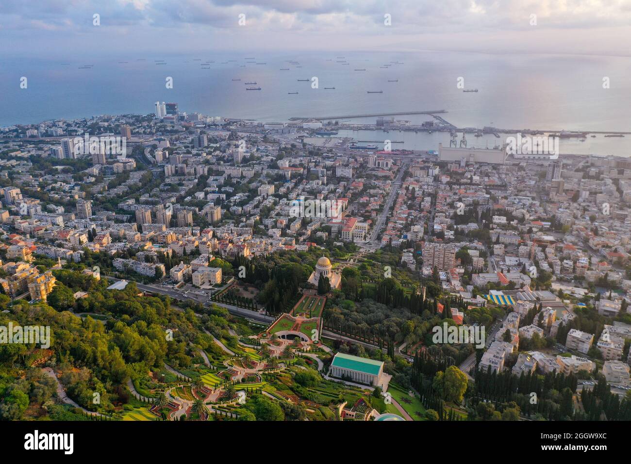 Bahai temple and gardens and Downtown Haifa at sunrise, Aerial image. Stock Photo