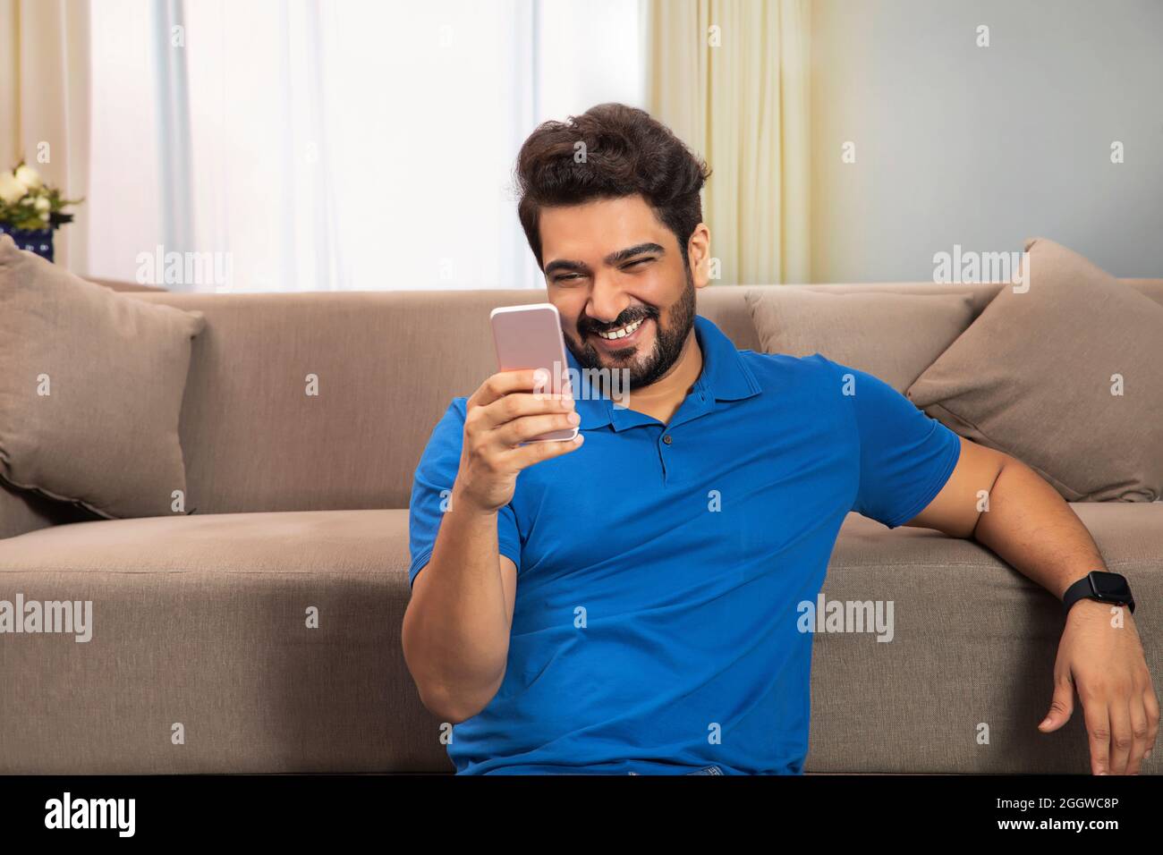 Happy man sitting hi-res stock photography and images - Alamy