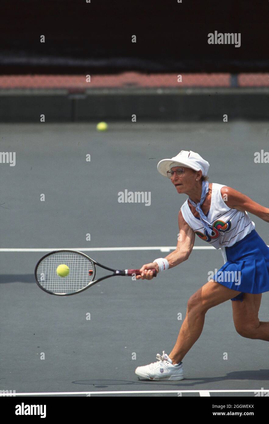 Baton Rouge Louisiana USA, 1993: Woman competes in doubles tennis match ...