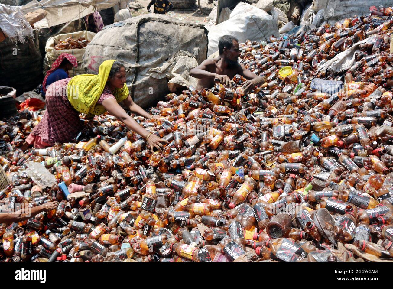 Dhaka, Bangladesh, 03/09/2021, Workers separate bottles polyethylene terephthalate (PET) in a