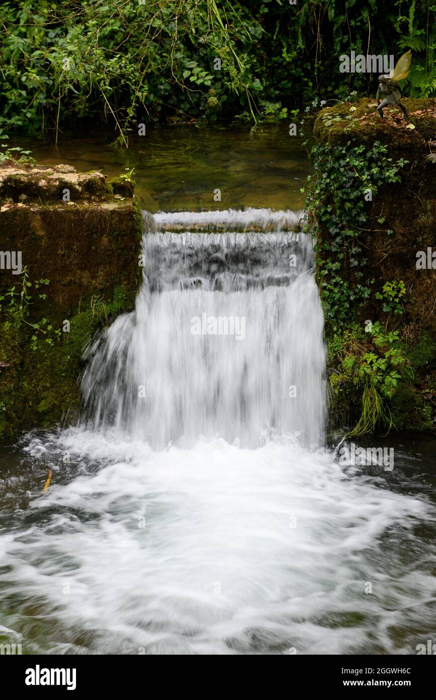 A narrow opening forms a small weir between two ponds Stock Photo Alamy