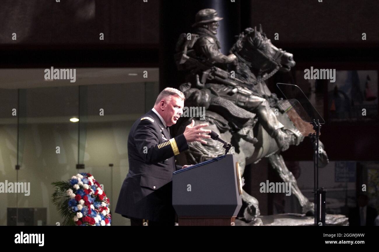 Lt. Gen. John Mulholland, commander of the U.S. Army Special Operations Command and former commander of Task Force Dagger, addresses the audience during the dedication and unveiling ceremony for the De Oppresso Liber statue at the Winter Garden Hall in Two World Financial Center near Ground Zero, Nov. 11, 2011. Members of Task Force Dagger; a Special Operations team made up Green Berets from 5th Special Forces Group (Airborne), aircrew members from the 160th Special Operations Aviation Regiment (Airborne), and combat controllers from Air Force Special Operations Command. Stock Photo