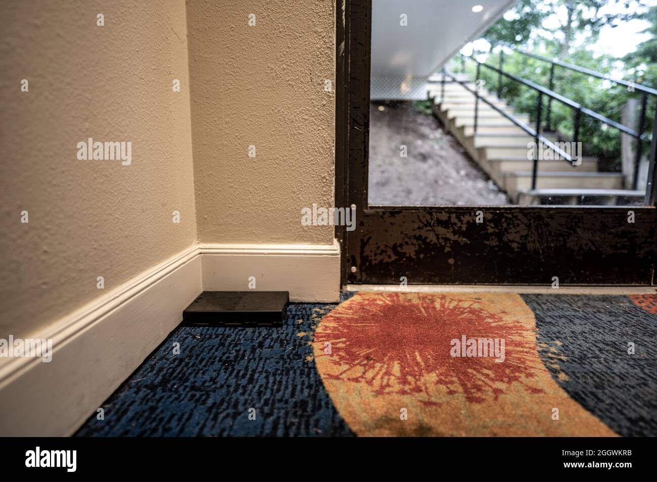 Professional pest control trap located in the entryway of a hotel Stock