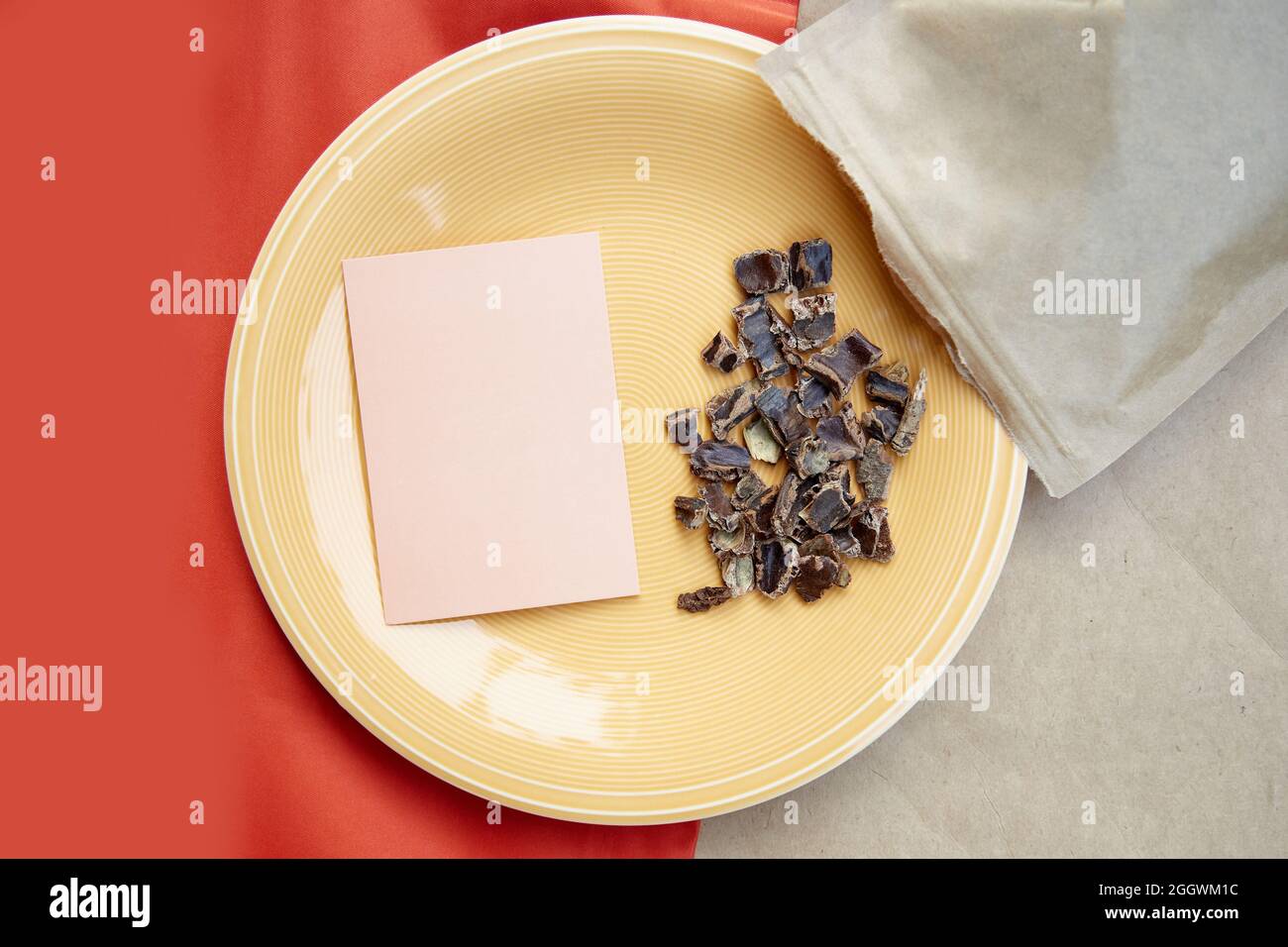 Carob - coffee alternative - organic product on the plate. Natural plant-based caffeine antioxidants. Mock up of business card. High quality photo Stock Photo