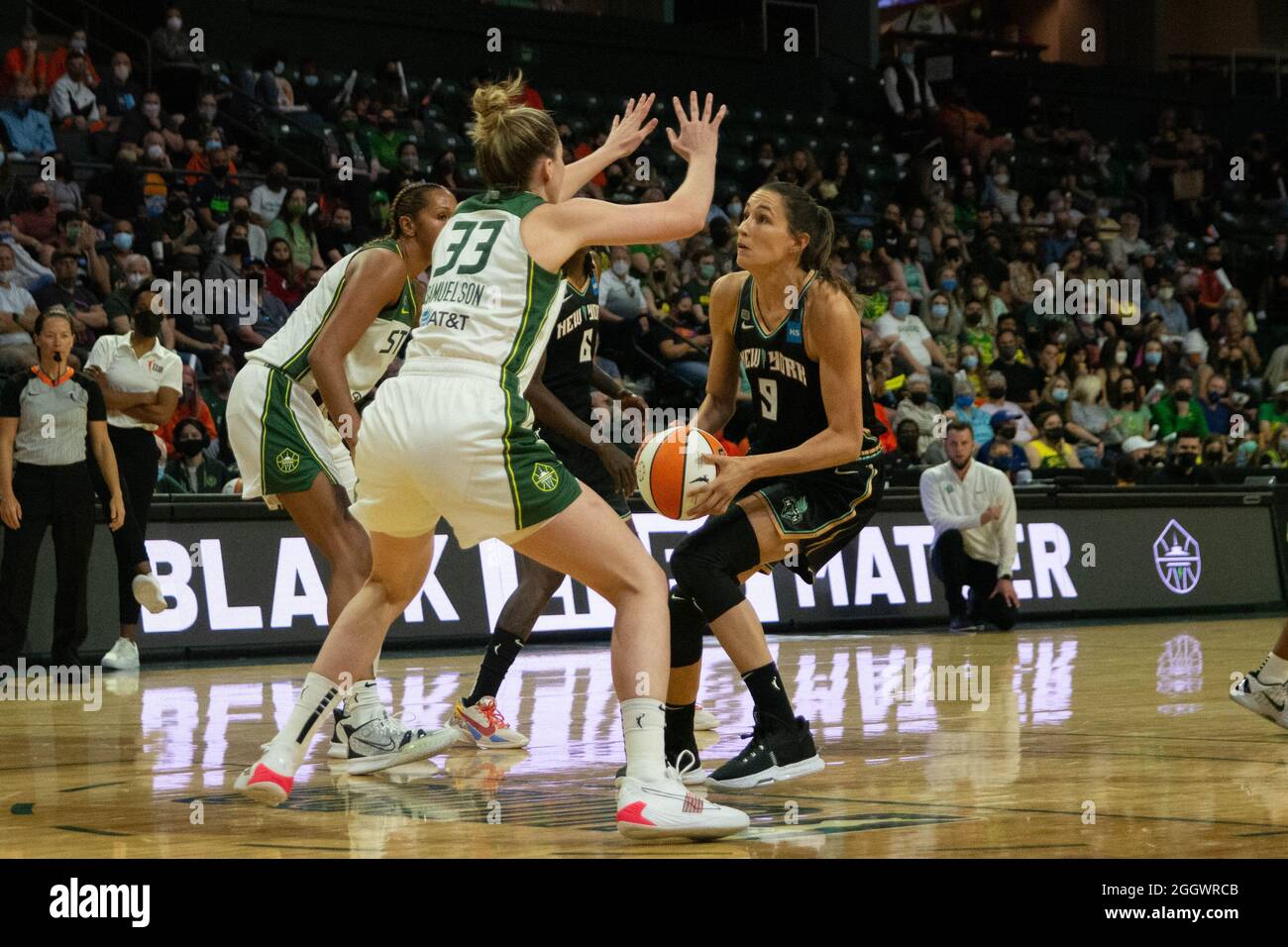 Rebecca Allen (9 New York Liberty) against Katie Lou Samuelson (33 Seattle  Storm) and Mercedes Russell (2 Seattle Storm) during the Womens National  Basketball Association game between Seattle Storm v New York