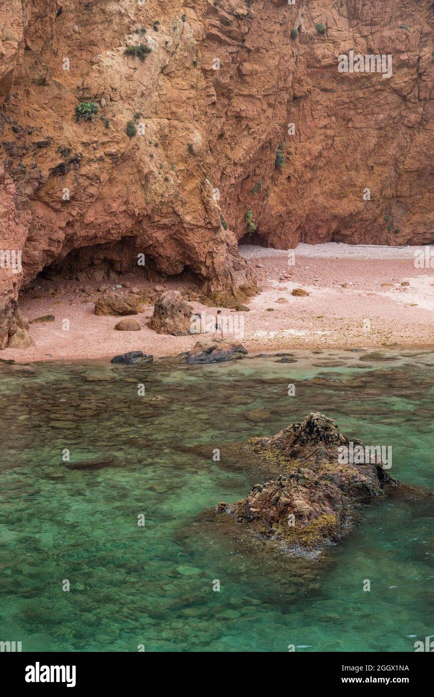 Boy at deserted beach at Berlenga Grande island, the largest island in the Berlengas archipelago, off the coast of Peniche, Portugal. Stock Photo